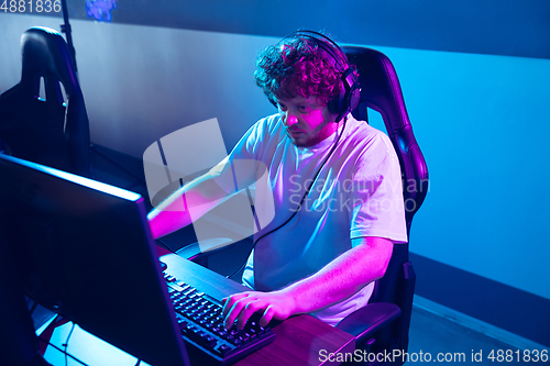 Image of Cyber sport. Fully concentrated professional cybersport player playing important match