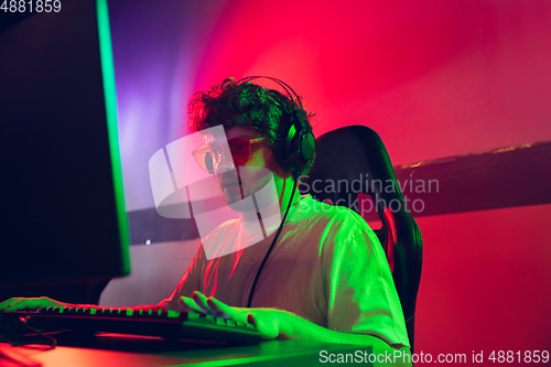 Image of Cyber sport. Fully concentrated professional cybersport player playing important match