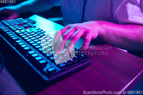 Image of Cyber sport. Fully concentrated professional cybersport player playing important match