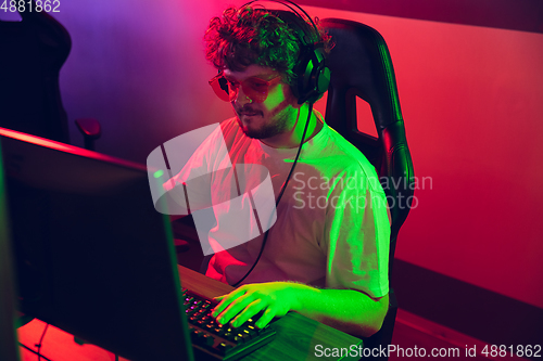 Image of Cyber sport. Fully concentrated professional cybersport player playing important match