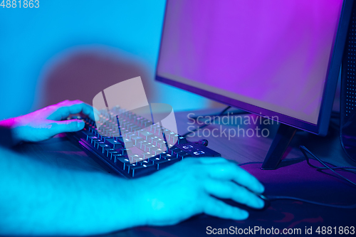 Image of Cyber sport. Fully concentrated professional cybersport player playing important match