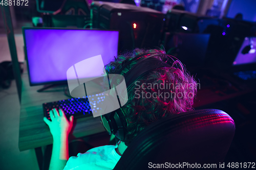 Image of Cyber sport. Fully concentrated professional cybersport player playing important match