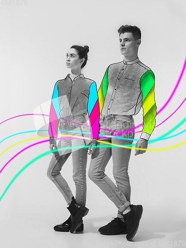 Image of Casual young stylish couple on white background with colourful art drawings in comics style