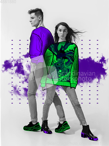 Image of Casual young stylish couple on white background with colourful art drawings in comics style