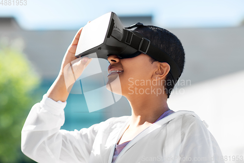 Image of happy african american woman with vr glasses