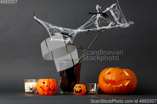 Image of pumpkins, candles and halloween decorations