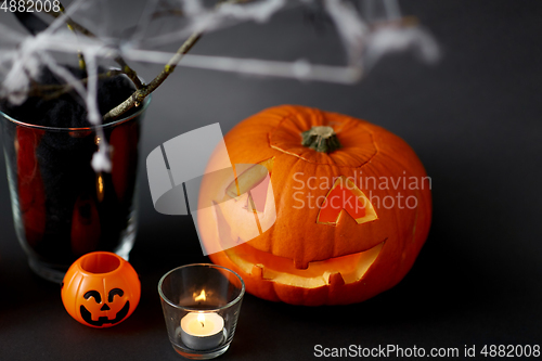 Image of pumpkins, candles and halloween decorations