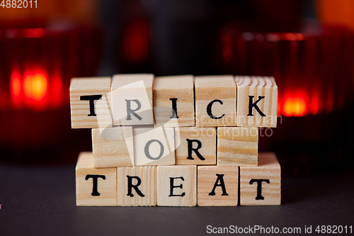 Image of toy blocks with trick or treat words on halloween