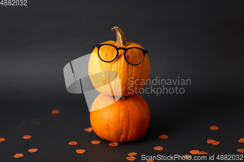Image of halloween pumpkins with glasses