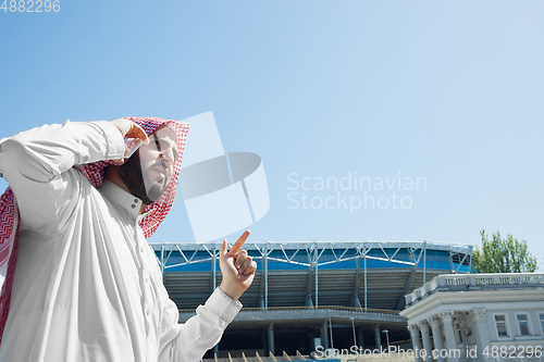 Image of Smiling rich arabian man\'s buying real estate in the city