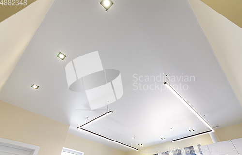 Image of Modern white matte stretch ceiling with zoned lighting