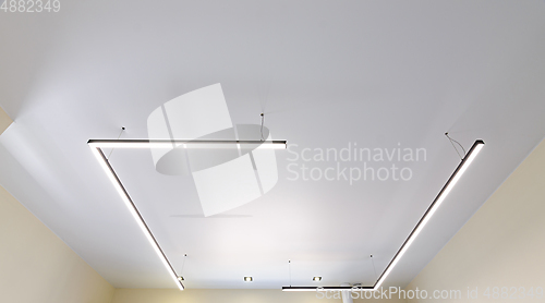 Image of Modern white matte stretch ceiling with original fixtures