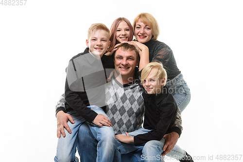 Image of Children and mom hug happy dad, portrait of large adult family, isolated on white background