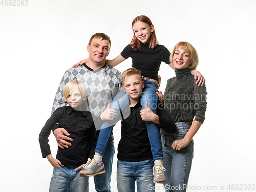 Image of Half-length portrait of an ordinary Russian family in casual clothes on a white background