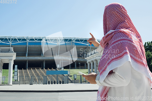 Image of Smiling rich arabian man\'s buying real estate in the city