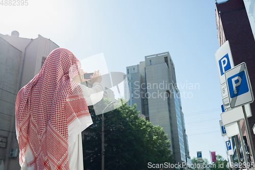 Image of Smiling rich arabian man\'s buying real estate in the city