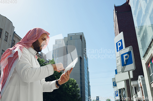 Image of Smiling rich arabian man\'s buying real estate in the city