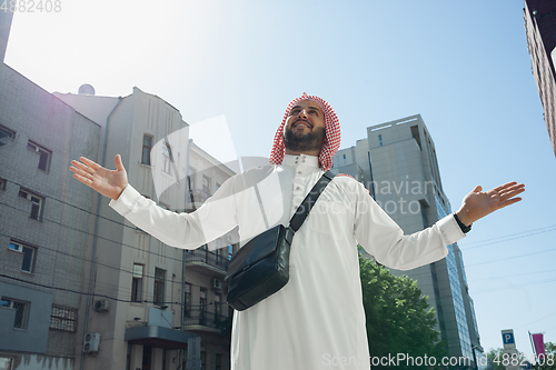 Image of Smiling rich arabian man\'s buying real estate in the city