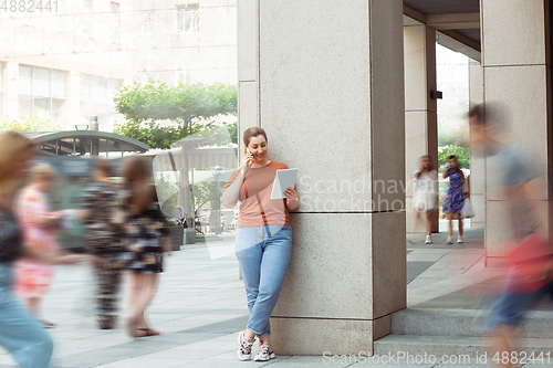 Image of Caucasian female inclusive plus-size model in her daily routine. Realness, tolerance, lifestyle