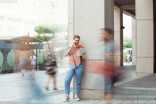 Image of Caucasian female inclusive plus-size model in her daily routine. Realness, tolerance, lifestyle