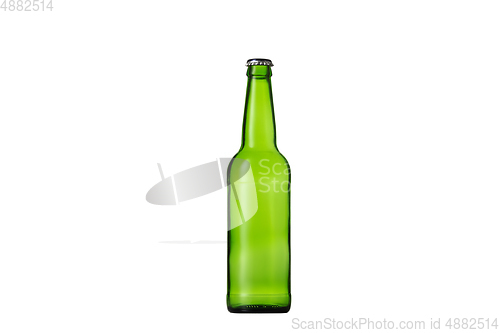 Image of Empty green colored beer bottle. Isolated on white studio background