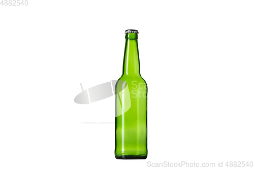 Image of Empty green colored beer bottle. Isolated on white studio background