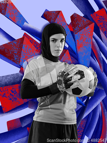Image of Young female football player, goalkeeper posing with colourful art drawings in comics style