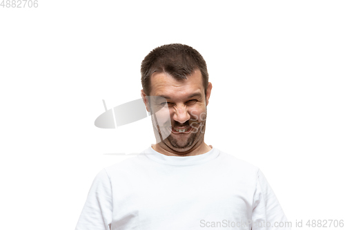 Image of Young caucasian man with funny, unusual popular emotions and gestures isolated on white studio background