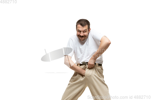 Image of Young caucasian man with funny, unusual popular emotions and gestures isolated on white studio background