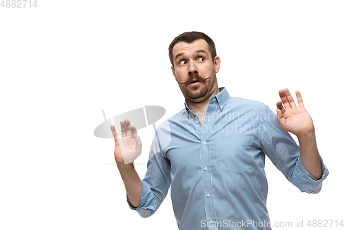 Image of Young caucasian man with funny, unusual popular emotions and gestures isolated on white studio background