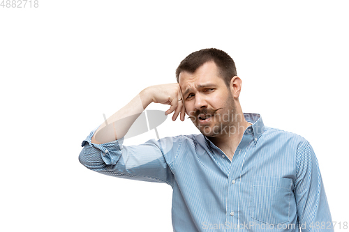 Image of Young caucasian man with funny, unusual popular emotions and gestures isolated on white studio background