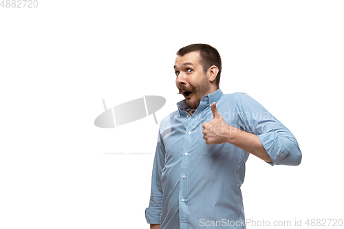 Image of Young caucasian man with funny, unusual popular emotions and gestures isolated on white studio background