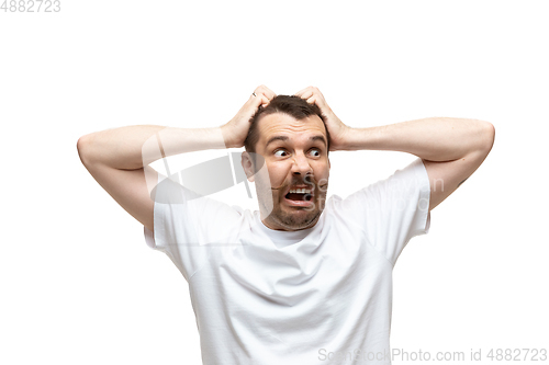 Image of Young caucasian man with funny, unusual popular emotions and gestures isolated on white studio background