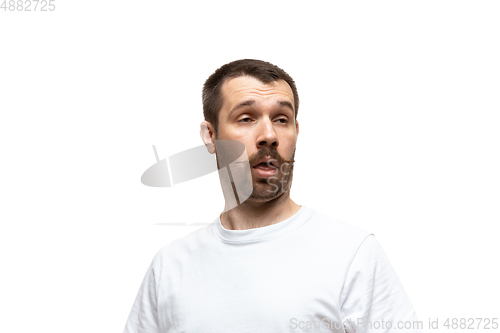 Image of Young caucasian man with funny, unusual popular emotions and gestures isolated on white studio background