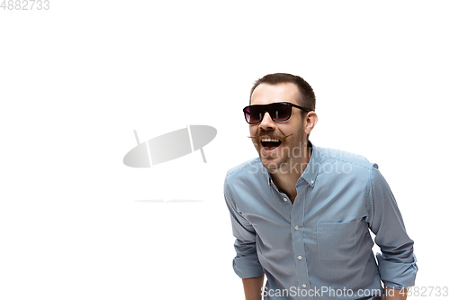 Image of Young caucasian man with funny, unusual popular emotions and gestures isolated on white studio background