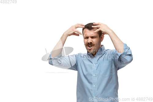 Image of Young caucasian man with funny, unusual popular emotions and gestures isolated on white studio background