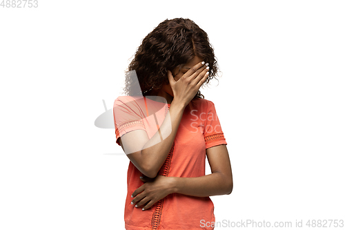 Image of Young african-american woman with funny, unusual popular emotions and gestures isolated on white studio background