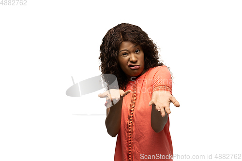 Image of Young african-american woman with funny, unusual popular emotions and gestures isolated on white studio background