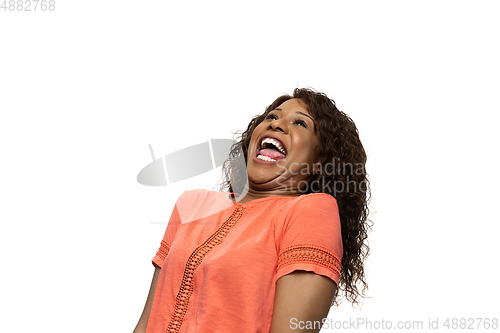 Image of Young african-american woman with funny, unusual popular emotions and gestures isolated on white studio background