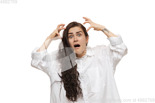 Image of Young caucasian woman with funny, unusual popular emotions and gestures isolated on white studio background