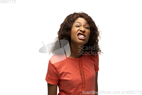 Image of Young african-american woman with funny, unusual popular emotions and gestures isolated on white studio background