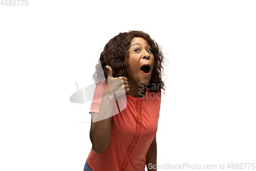 Image of Young african-american woman with funny, unusual popular emotions and gestures isolated on white studio background