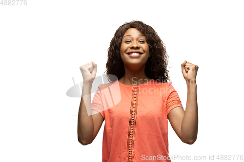 Image of Young african-american woman with funny, unusual popular emotions and gestures isolated on white studio background