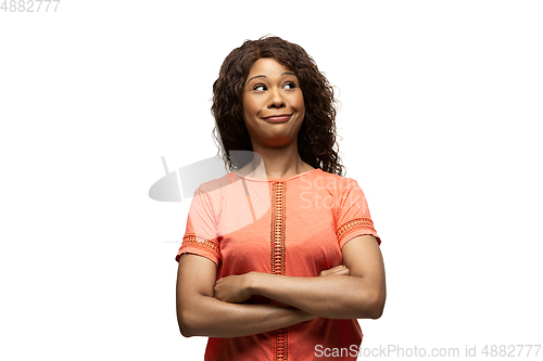 Image of Young african-american woman with funny, unusual popular emotions and gestures isolated on white studio background