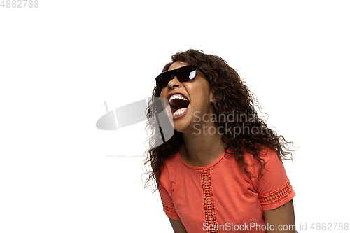 Image of Young african-american woman with funny, unusual popular emotions and gestures isolated on white studio background