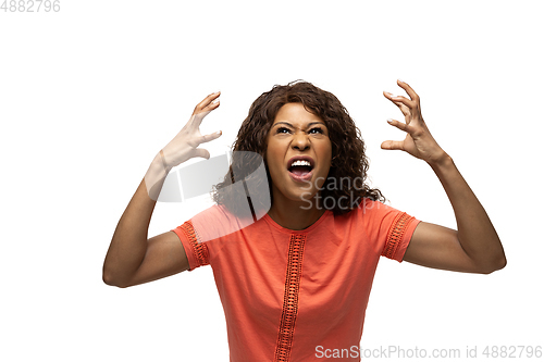 Image of Young african-american woman with funny, unusual popular emotions and gestures isolated on white studio background