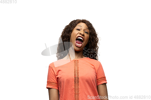 Image of Young african-american woman with funny, unusual popular emotions and gestures isolated on white studio background