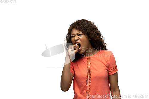 Image of Young african-american woman with funny, unusual popular emotions and gestures isolated on white studio background