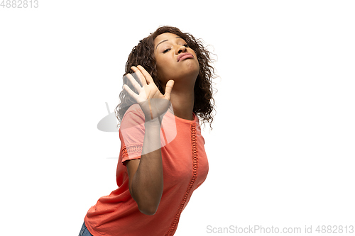 Image of Young african-american woman with funny, unusual popular emotions and gestures isolated on white studio background