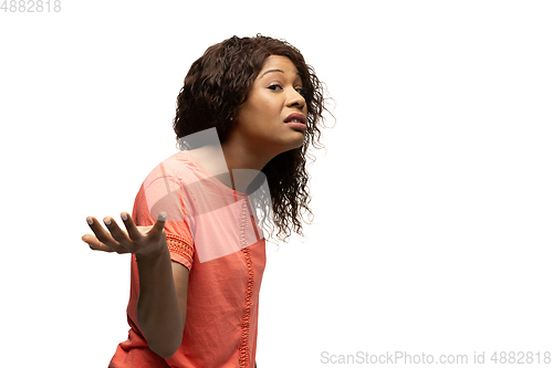 Image of Young african-american woman with funny, unusual popular emotions and gestures isolated on white studio background